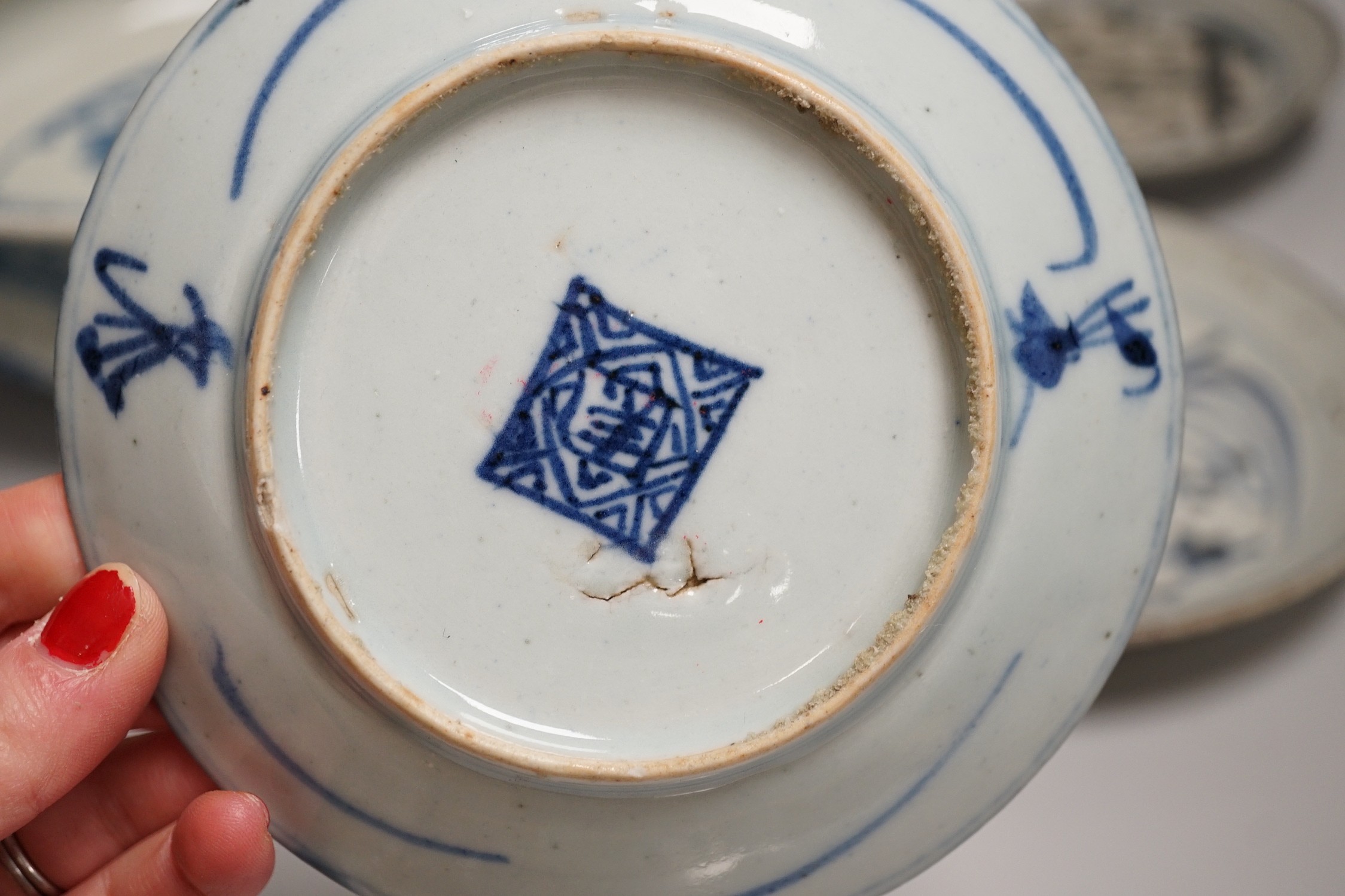 A Chinese blue and white bowl, tea bowl and saucer, and two other dishes, largest 29cm diameter